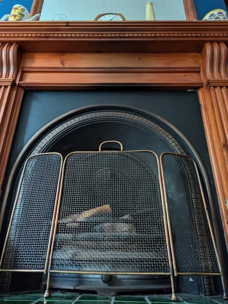 1930s brass fireguard