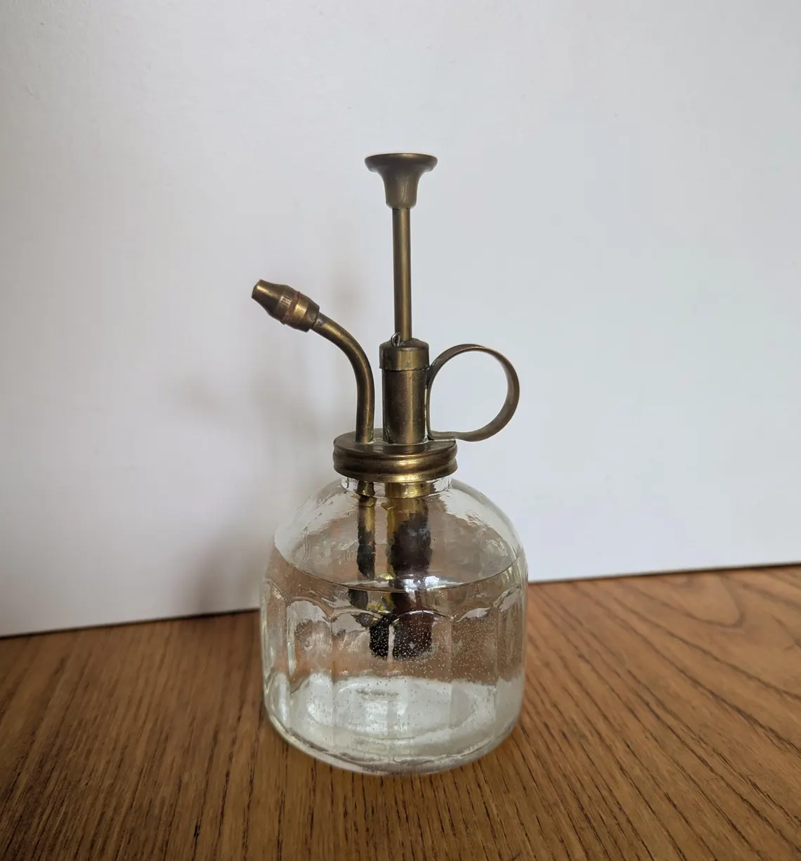 glass and brass water spritzer
