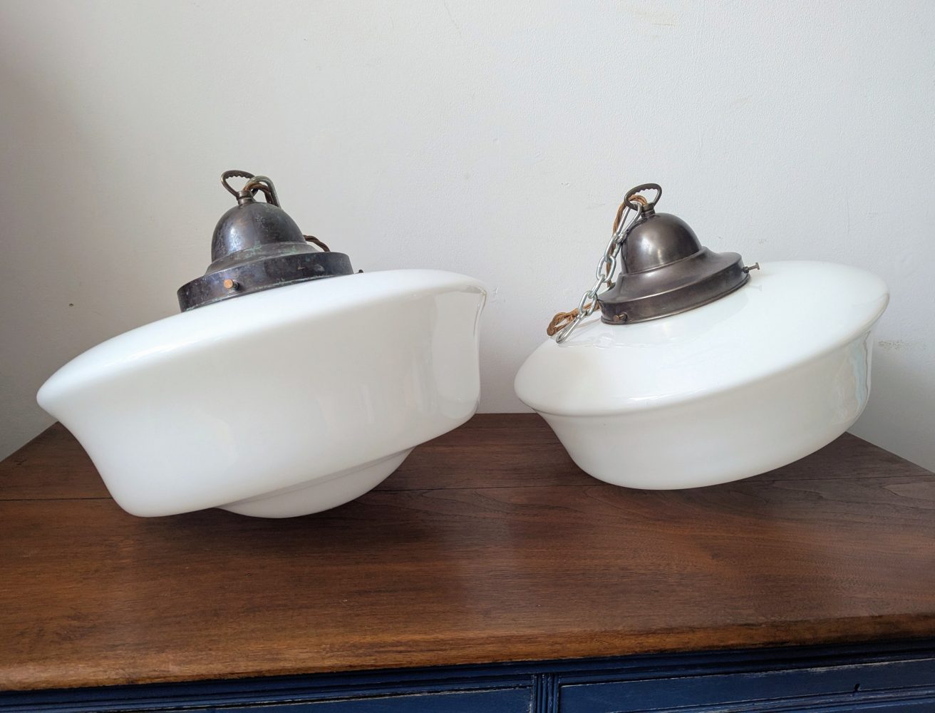 Matched pair of c.1930s large opaline glass Art Deco pendant lights with nickel galleries