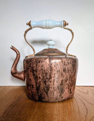Antique copper kettle with milk glass handle and knop