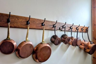 Set of 9 antique copper pans with iron handles and copper frying pans
