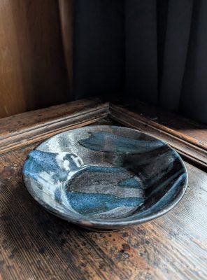 Vintage slipware salt glaze black and blue bowl