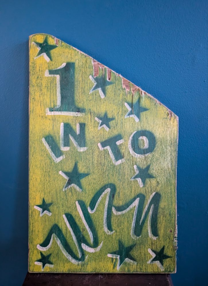 Vintage handpainted colourful fairground sign