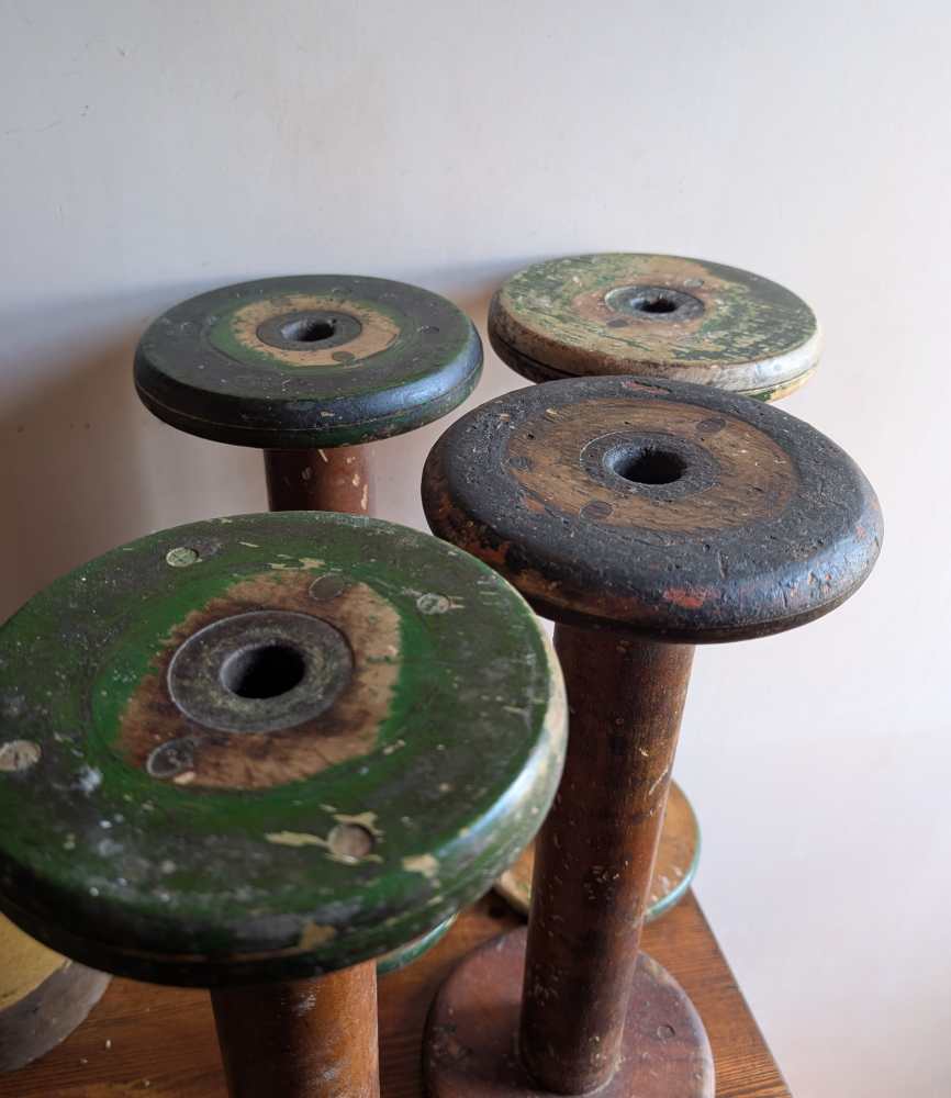 Large early 1900s wooden mill bobbins