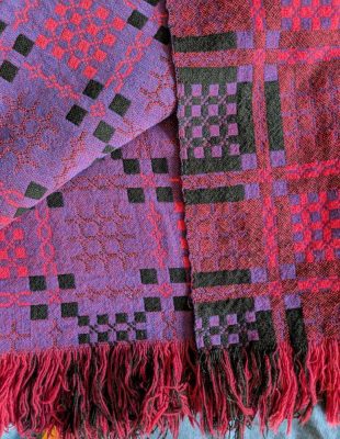 Vintage Welsh wool double sided blanket in purples and pinks