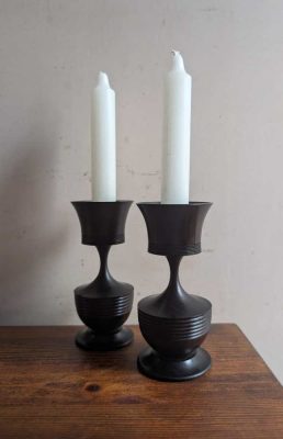 Pair of small ebony candlesticks
