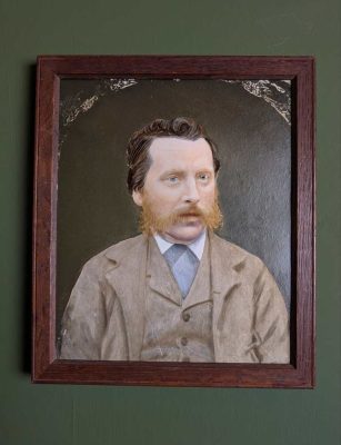 Original oil on board portrait of wool-suited gentleman in vintage oak frame