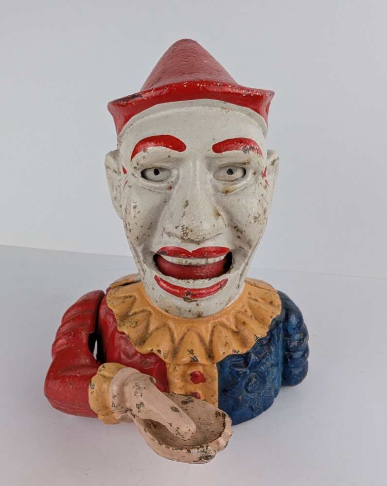 Vintage clown coin-eater, fully functional mechanical money bank