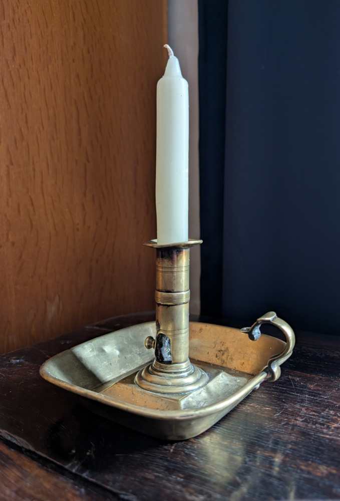 Antique brass chamberstick with slide