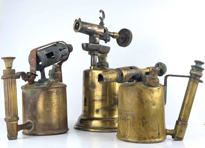 Three antique brass blow lamps