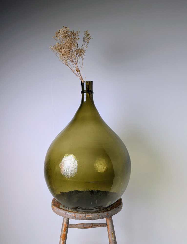 Giant green glass carboy demijohn