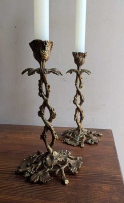 Antique pair of elaborate vine and leaf brass candlesticks