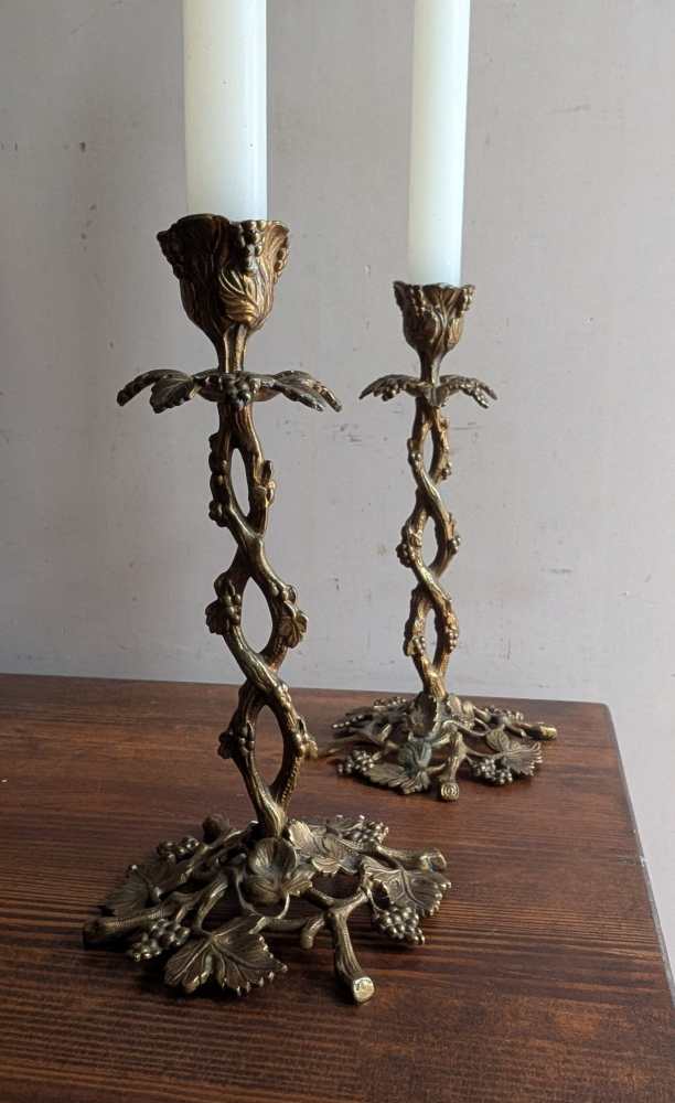 Antique pair of elaborate vine and leaf brass candlesticks