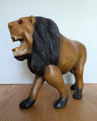 Wood sculpted roaring Lion
