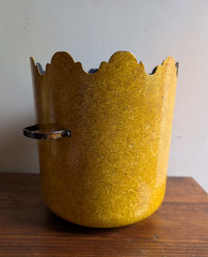 Turreted metal yellow plant pot