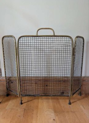 Brass c.1920s fireguard on raised feet
