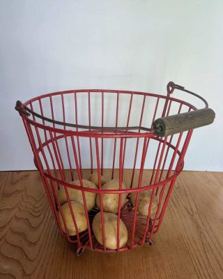 Vintage red potato pickers bucket