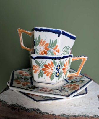 Pair of 1930s Henriot Quimper Faience pottery cups and saucers
