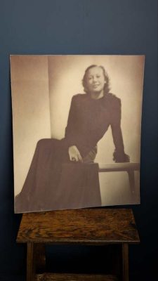 Large photographic portrait of 1940s fashion designer