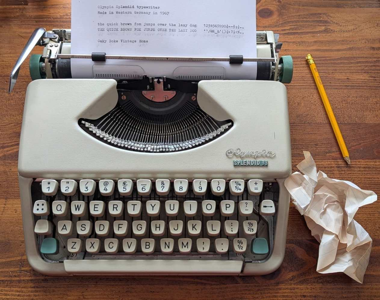Olympia Splendid 33 typewriter (1967) compact portable typewriter in original tan leather case with instruction booklet